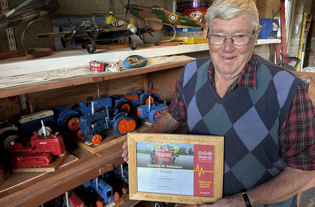 Tractor man hits target of £30,000 for air ambulance 